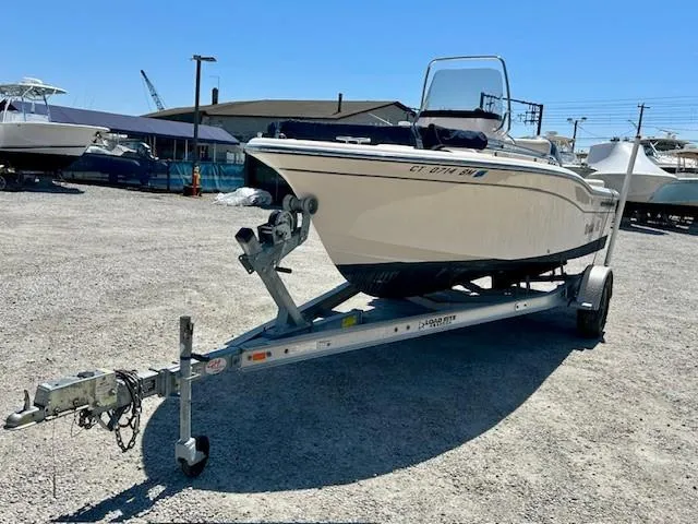 Slide: The Image of 2020 Grady-White Fisherman 180 boat on trailer in a sunny marina. - 18