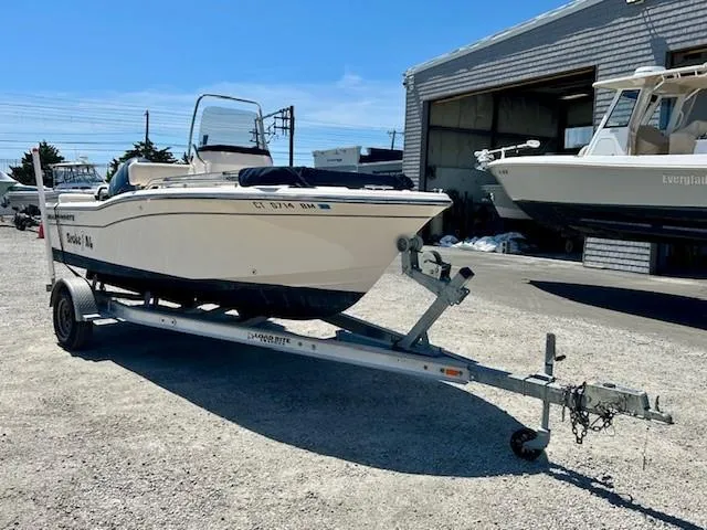 Slide: The Image of 2020 Grady-White Fisherman 180 boat on trailer, parked outside a marina. - 19