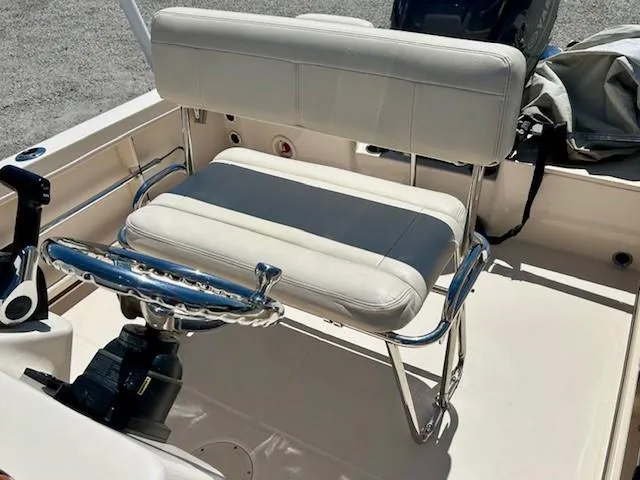 Slide: The Image of 2020 Grady-White Fisherman 180 boat interior with cushioned seating and steering wheel. - 5
