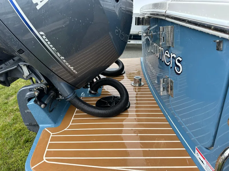 Slide: The Image of 2020 Regulator 23 Forward Seating boat with Yamaha outboard motor on teak deck. - 11