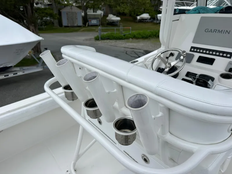 Slide: The Image of 2020 Regulator 23 Forward Seating boat with rod holders and Garmin navigation system. - 3