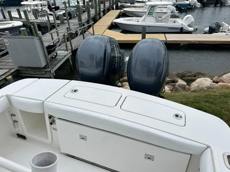 Slide: The Image of 2020 Regulator 23 Forward Seating boat with dual engines docked at marina. - 8