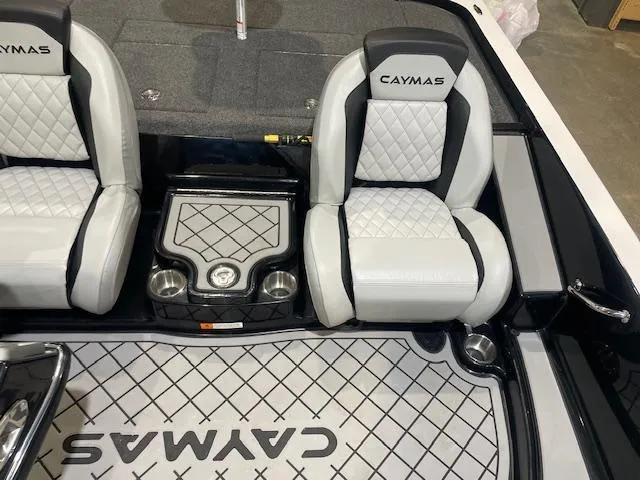 Slide: The Image of 2025 Caymas CX21Pro boat interior with quilted seats and branded flooring. - 10