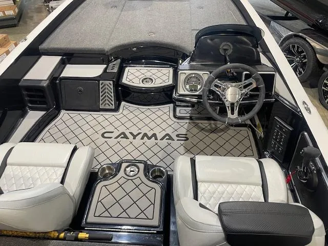 Slide: The Image of 2025 Caymas CX21Pro boat interior with modern dashboard and seating. - 11