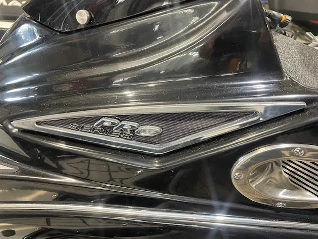 Slide: The Image of 2025 Caymas CX21Pro DR Series badge on sleek black surface. - 12