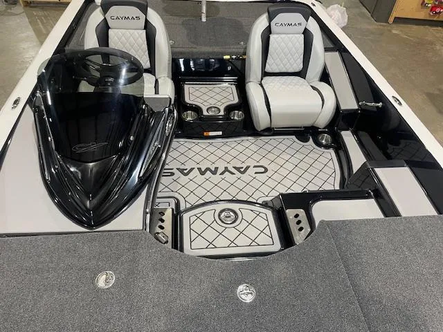 Slide: The Image of 2025 Caymas CX21Pro boat interior with dual seats and steering console. - 9