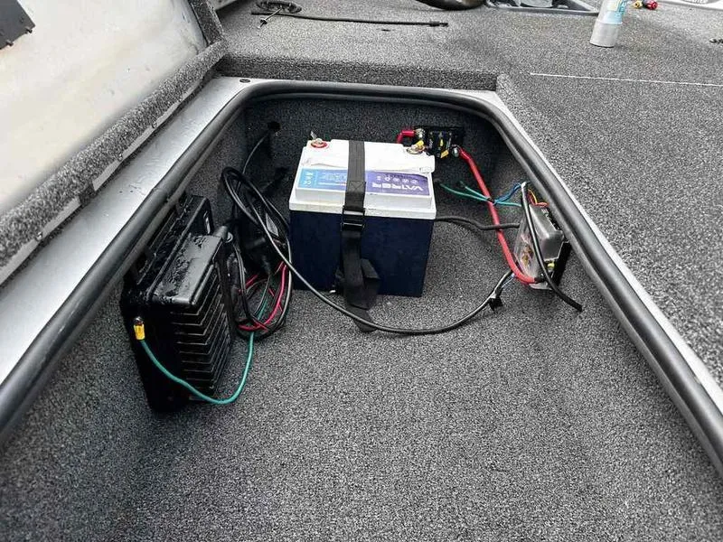 Slide: The Image of 2016 Ranger RT188 boat battery compartment with wiring and components. - 9