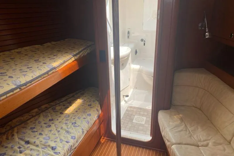 Slide: The Image of Interior of 1992 Nautor Swan 44 yacht with bunk beds and bathroom. - 5