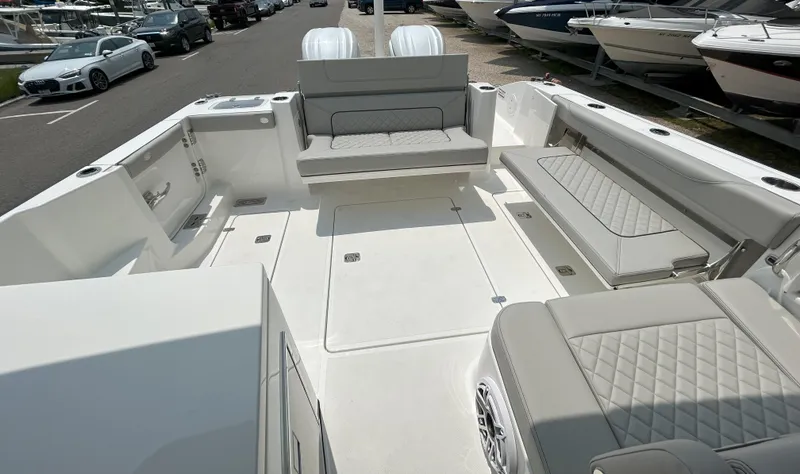 Slide: The Image of 2026 Pursuit DC 326 boat interior with spacious seating and modern design. - 6