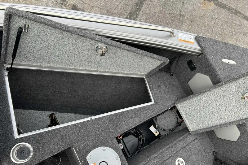 Slide: The Image of Interior view of 2026 Lund 1975 Tyee boat storage compartments and wiring. - 15
