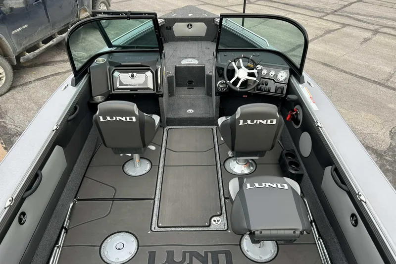 Slide: The Image of Interior of 2026 Lund 1975 Tyee boat with dual seats and modern dashboard. - 16
