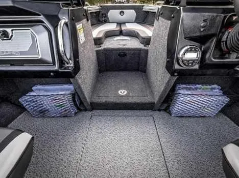 Slide: The Image of Interior of 2026 Lund 1975 Tyee boat with steering wheel and seating. - 2