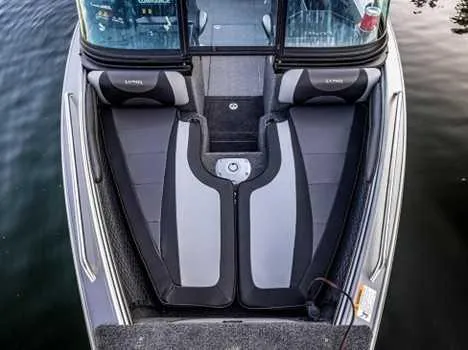 Slide: The Image of Interior view of 2026 Lund 1975 Tyee boat, featuring steering wheel and dashboard controls. - 4