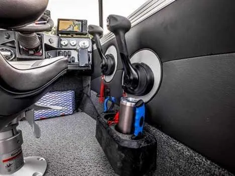 Slide: The Image of Open glove compartment of 2026 Lund 1975 Tyee boat with manuals and accessories. - 7