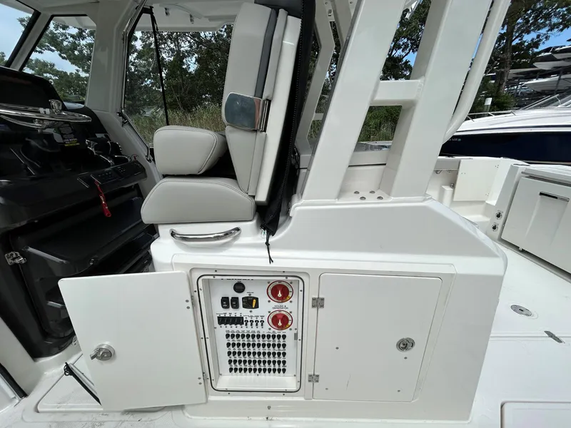 Slide: The Image of 2026 Pursuit S 328 boat interior with control panel and seating. - 11
