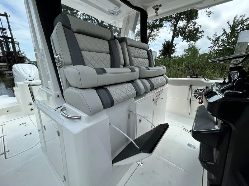 Slide: The Image of Luxurious seating on 2026 Pursuit S 328 boat, featuring quilted upholstery and modern design. - 12