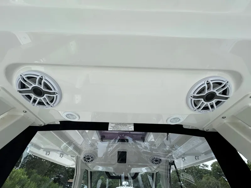 Slide: The Image of 2026 Pursuit S 328 boat interior with mounted speakers and sleek design. - 16