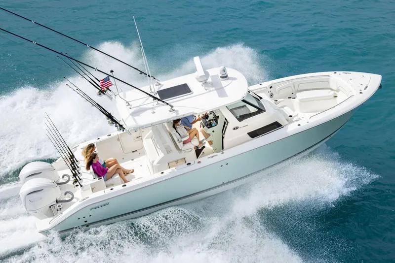 Slide: The Image of 2026 Pursuit S 328 boat cruising on open water with passengers onboard. - 27