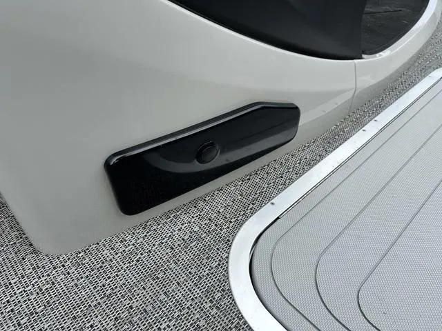 Slide: The Image of 2025 Barletta Boats C20UC deck detail with sleek design and textured flooring. - 11