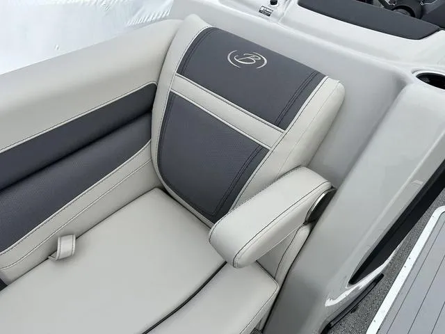 Slide: The Image of 2025 Barletta C20UC boat seat with gray and beige upholstery, featuring armrest and logo. - 12