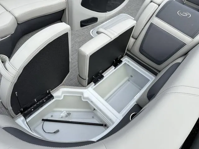 Slide: The Image of 2025 Barletta Boats C20UC interior storage compartments with open seats, showcasing spacious design. - 17