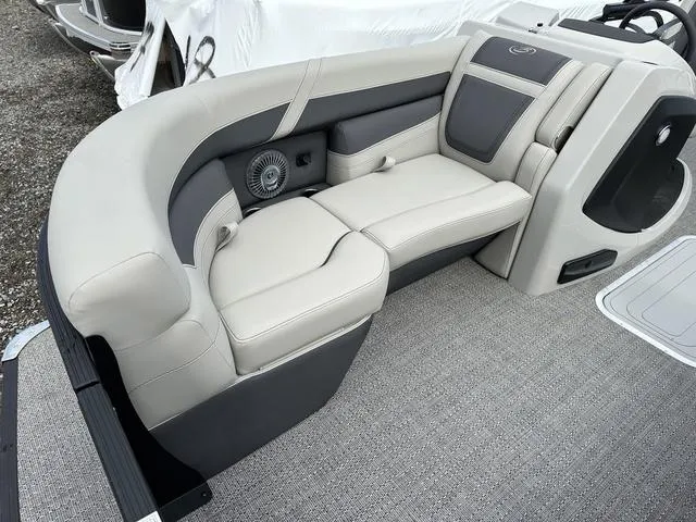 Slide: The Image of 2025 Barletta Boats C20UC interior seating with gray upholstery and integrated speaker system. - 18