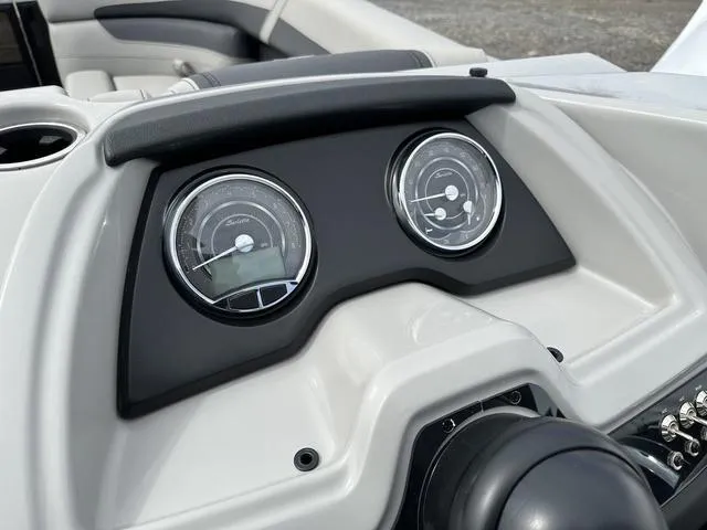 Slide: The Image of Dashboard of 2025 Barletta Boats C20UC with dual gauges and sleek design. - 23