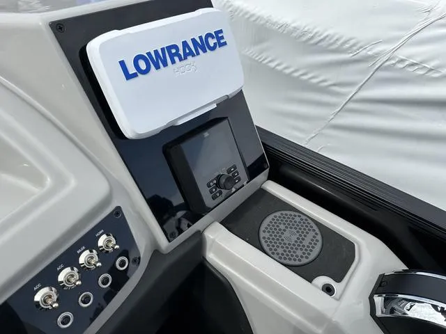 Slide: The Image of Barletta Boats C20UC 2025 dashboard featuring Lowrance electronics and control panel. - 24