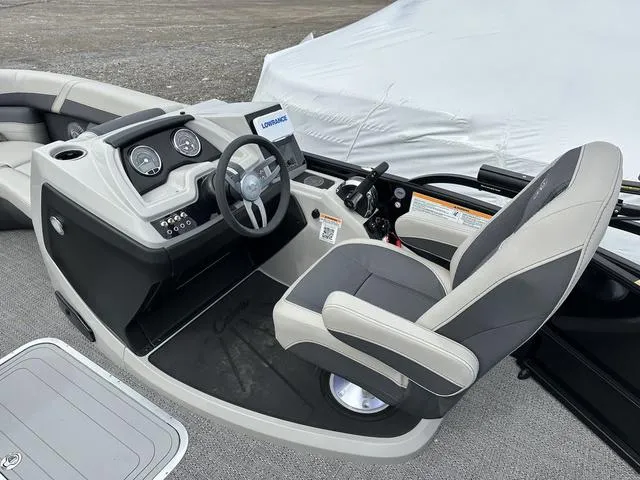 Slide: The Image of 2025 Barletta Boats C20UC helm with modern controls and comfortable seating. - 28