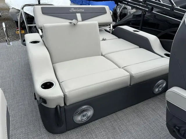 Slide: The Image of 2025 Barletta C20UC boat interior with gray seating and cup holders. - 30