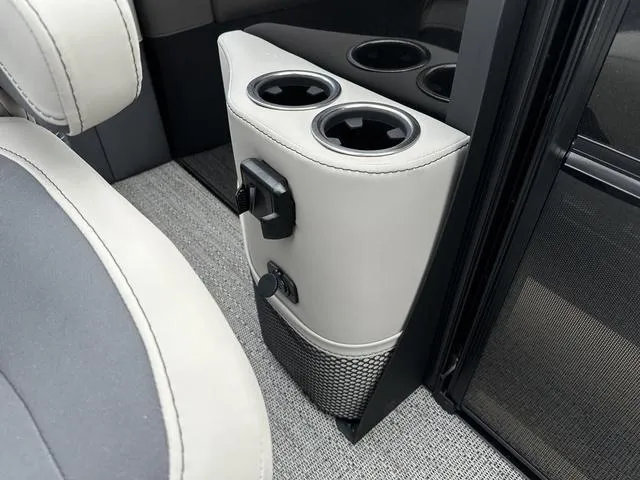 Slide: The Image of 2025 Barletta Boats C20UC interior with cup holders and modern design. - 31