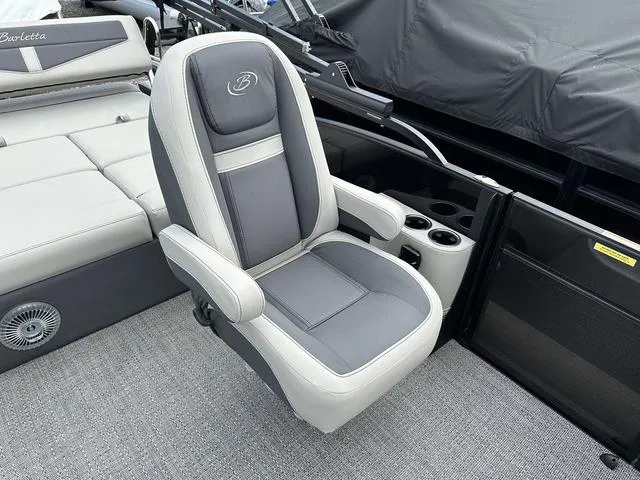 Slide: The Image of Captain's chair on 2025 Barletta Boats C20UC pontoon, featuring sleek design and comfortable seating. - 32
