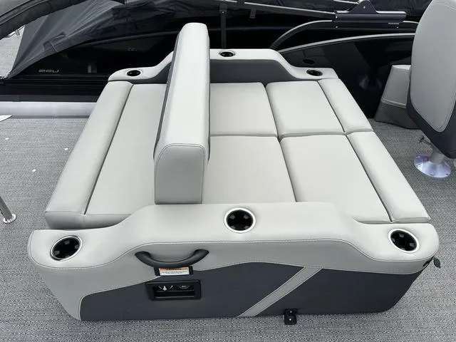 Slide: The Image of 2025 Barletta Boats C20UC seating area with cup holders and adjustable backrest. - 36