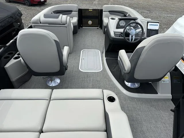 Slide: The Image of Interior of 2025 Barletta Boats C20UC, featuring modern seating and steering console. - 37