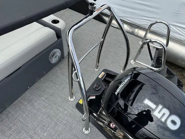 Slide: The Image of 2025 Barletta C20UC boat with Mercury engine and sleek chrome railings. - 38