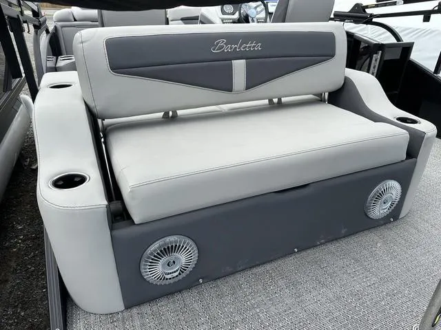 Slide: The Image of 2025 Barletta C20UC boat seat with cup holders and speakers, featuring gray upholstery. - 39