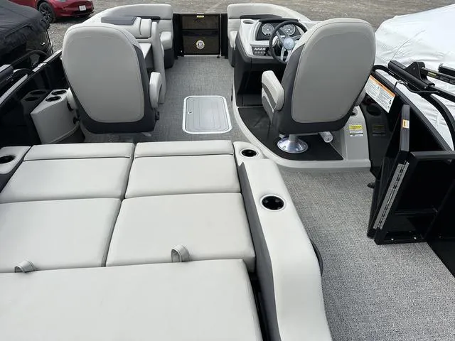 Slide: The Image of 2025 Barletta Boats C20UC interior with plush seating and modern dashboard. - 4