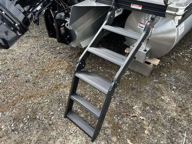 Slide: The Image of 2025 Barletta Boats C20UC with foldable boarding ladder on gravel surface. - 41