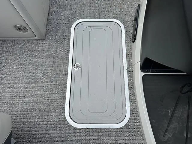 Slide: The Image of 2025 Barletta Boats C20UC deck hatch on textured flooring. - 43