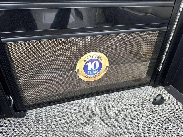 Slide: The Image of 10-year warranty badge on 2025 Barletta Boats C20UC interior panel. - 9