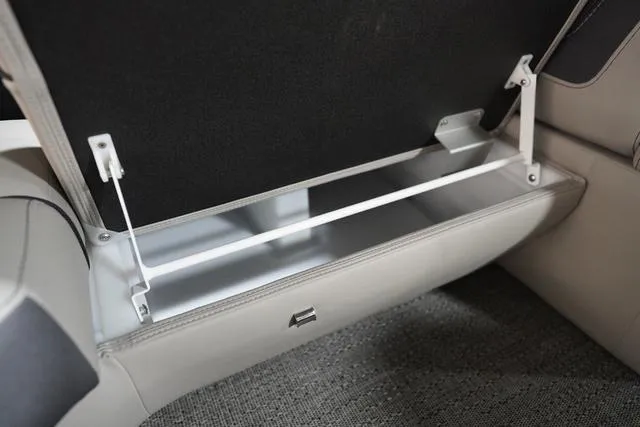 Slide: The Image of 2025 Barletta Corsa 23UC boat storage compartment with open lid, showcasing interior space. - 10