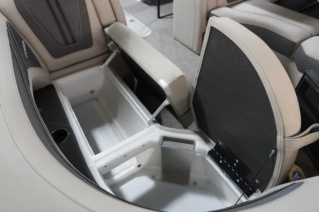 Slide: The Image of 2025 Barletta Corsa 23UC boat interior storage compartment with open seat. - 11