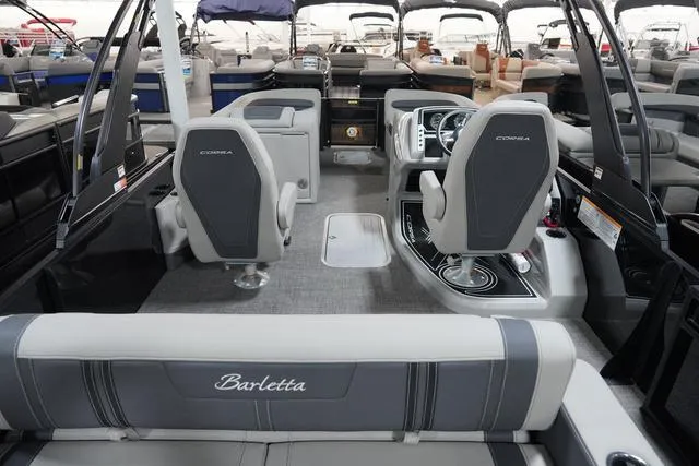 Slide: The Image of 2025 Barletta Corsa 23UC boat interior with modern seating and sleek design. - 17