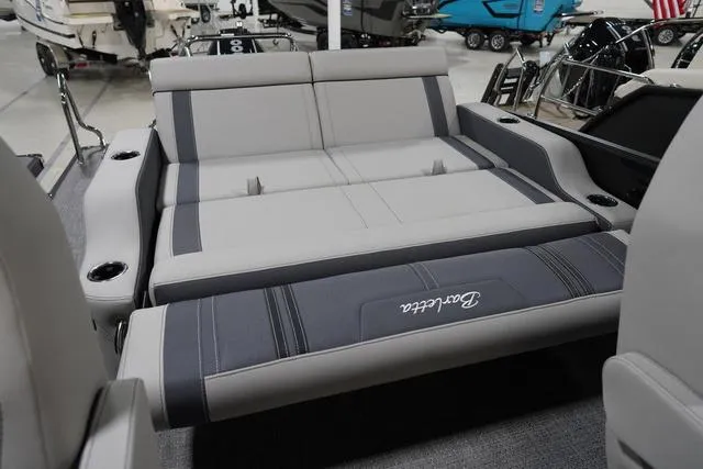 Slide: The Image of 2025 Barletta Corsa 23UC boat interior with luxurious gray seating and cup holders. - 19