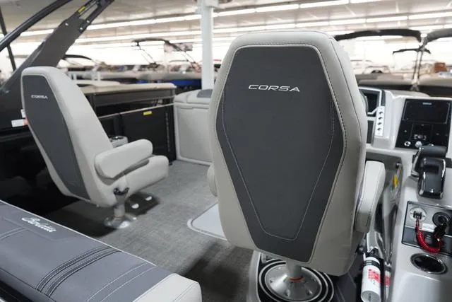 Slide: The Image of 2025 Barletta Corsa 23UC boat interior with modern seating and control panel. - 20