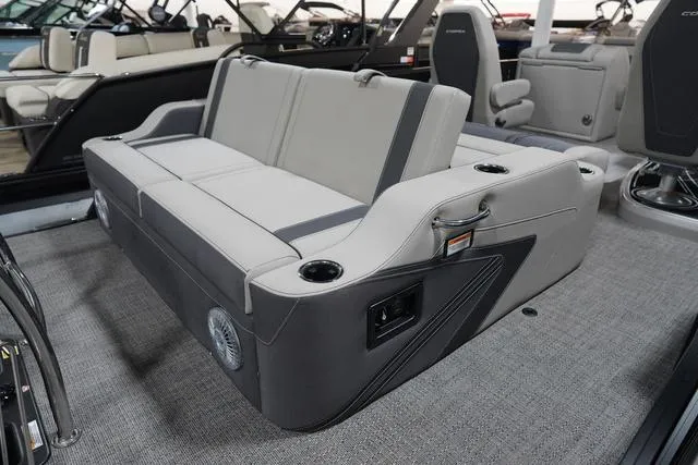 Slide: The Image of 2025 Barletta Corsa 23UC boat interior with gray seating and cup holders. - 21