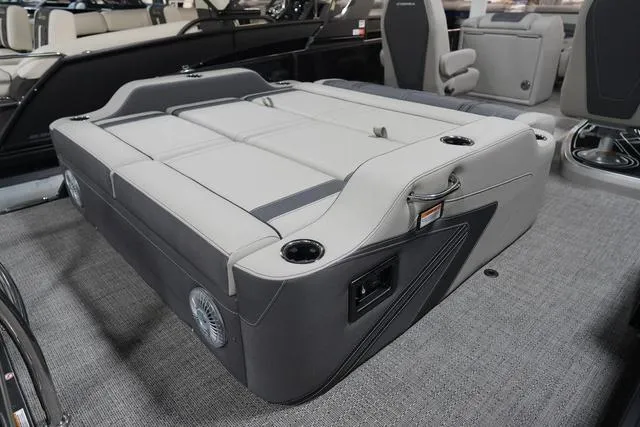 Slide: The Image of 2025 Barletta Corsa 23UC boat interior with luxurious seating and cup holders. - 22