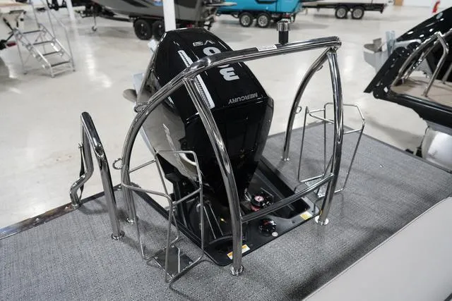 Slide: The Image of 2025 Barletta Corsa 23UC boat engine with protective railing in showroom. - 26