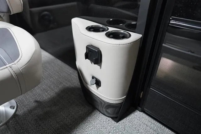 Slide: The Image of 2025 Barletta Corsa 23UC boat interior with cup holders and power outlets. - 31