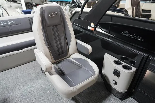 Slide: The Image of 2025 Barletta Corsa 23UC boat interior with luxury seating and cup holders. - 32